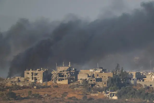 Smoke rises in Gaza before the start of a temporary truce between Hamas and Israel, as seen from southern Israel