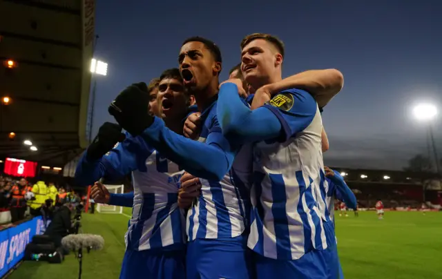 Brighton celebrate in front of their fans.