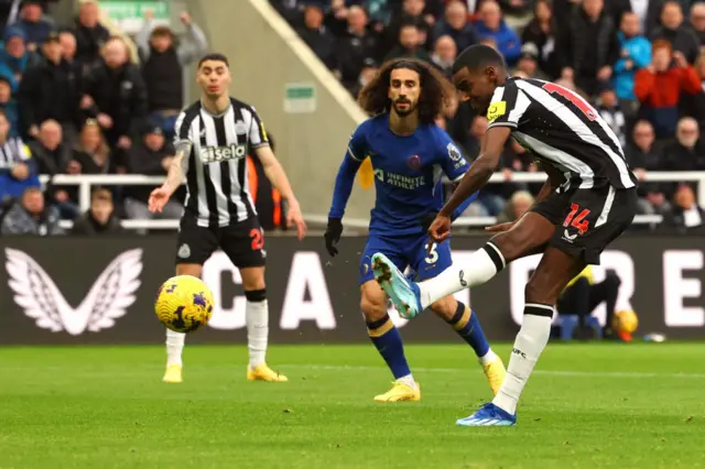 Alexander Isak strikes the ball.