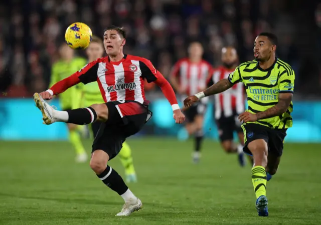 Yehor Yarmolyuk with a high kick as Gabriel Jesus looks on.