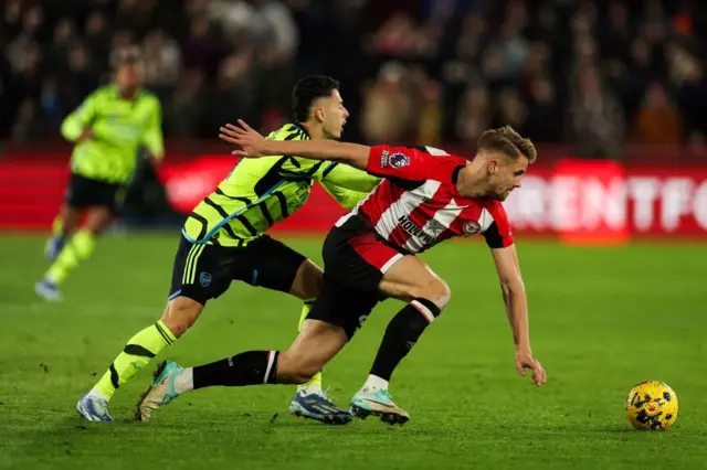 Gabriel Martinelli fights for the ball from Brentford's Kristoffer Ajer