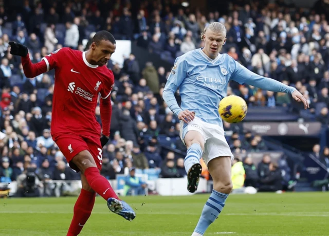 Matip clears the ball as Haaland closes him down