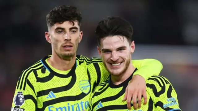 Kai Havertz has his arm around Declan Rice.