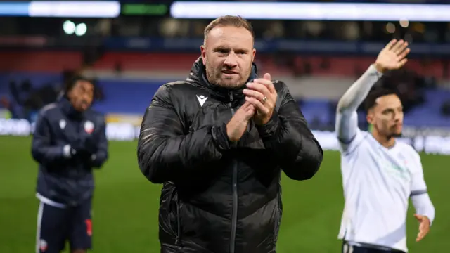 Bolton manager Ian Evatt celebrates the win