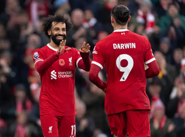 Mohamed Salah of Liverpool celebrates scoring with team mate Darwin Nunez