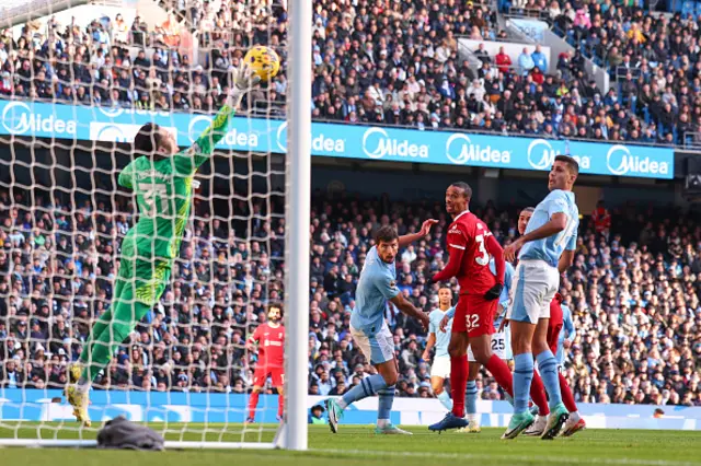 Ederson of Manchester City saves from Darwin Nunez