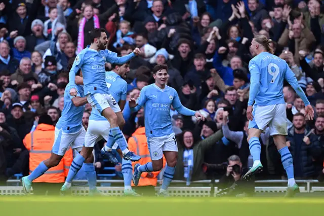 Erling Haaland of Manchester City celebrates with teammates