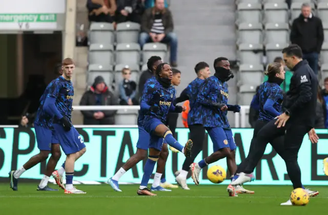 Raheem Sterling joins his team mates in the warm up.