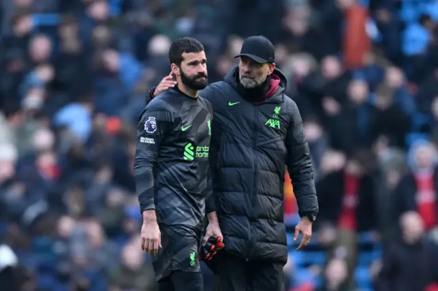 Alisson and Jurgen Klopp.