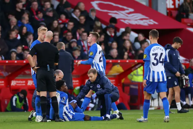 Tariq Lamptey receives treatment.