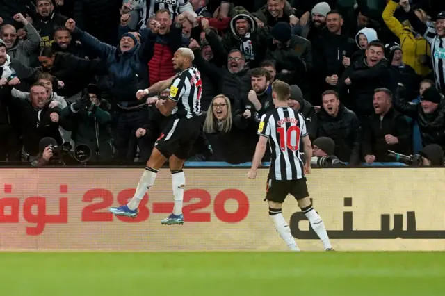 Joelinton celebrates scoring.