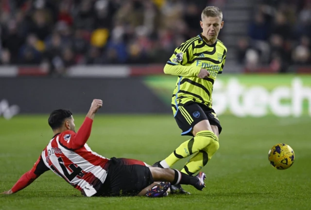 Zinchenko is challenged by Saman Ghoddos