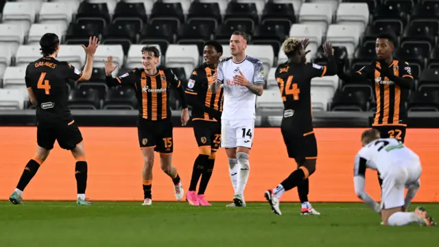 Swansea players look frustrated after Hull City score in their 2-2 draw