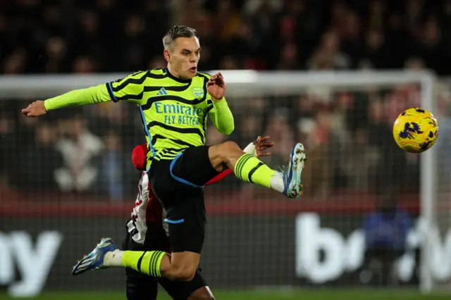 Leandro Trossard lunges at the ball