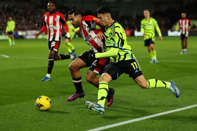 Saman Ghoddos fights with Arsenal's Gabriel Martinelli for the ball.