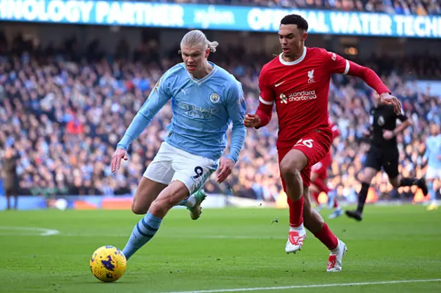 Erling Haalandand Trent Alexander-Arnold battle for possession