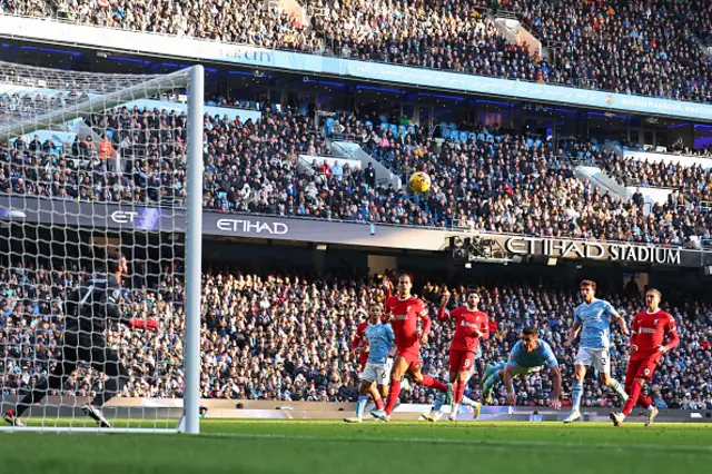 Rodri of Manchester City heads over the bar