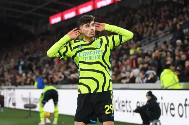 Kai Havertz puts his hands behind his ears.