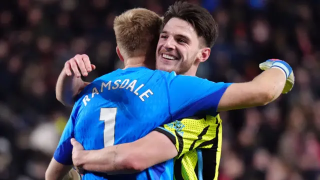 Declan Rice hugs Aaron Ramsdale.