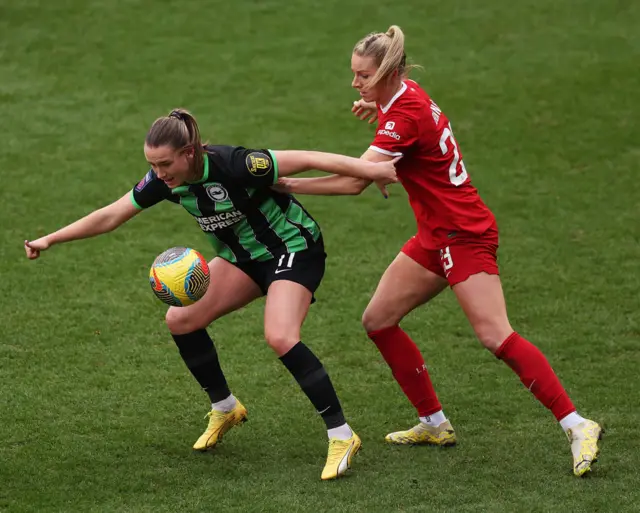 Elisabeth Terland of Brighton & Hove Albion battles for possession with Gemma Bonner.