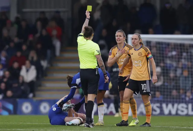 Leicester's Lena Petermann is shown a yellow card