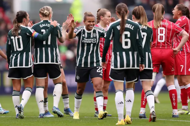 Nikita Parris celebrates with her team mates.