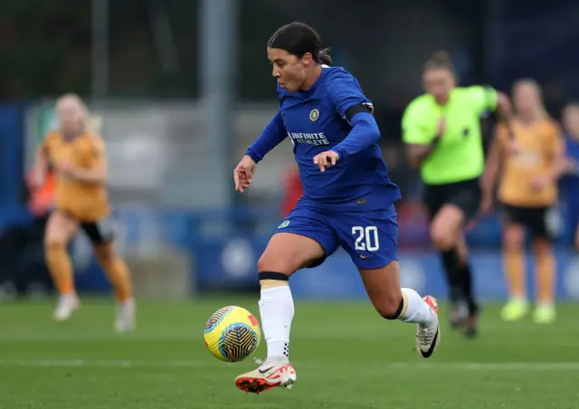 Sam Kerr drives forward.