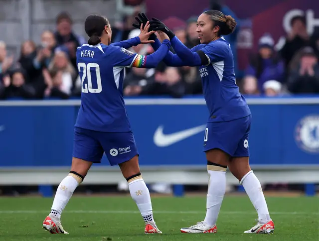 Sam Kerr high fives Lauren James.