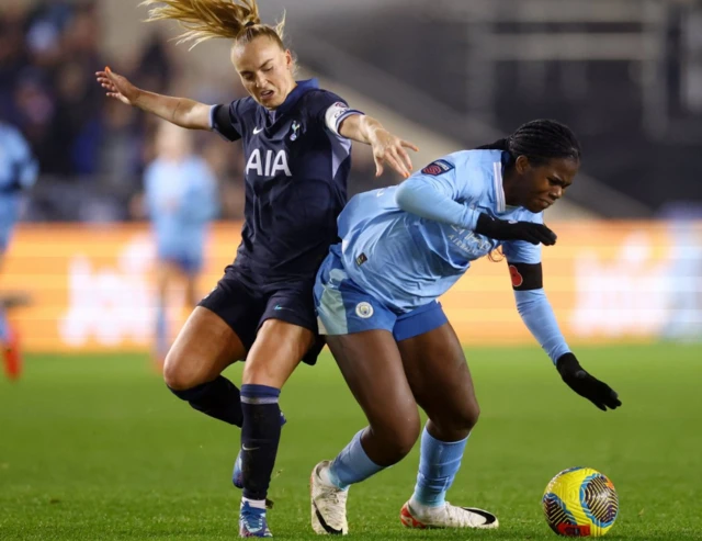 Molly Bartrip in action with Manchester City's Khadija Shaw