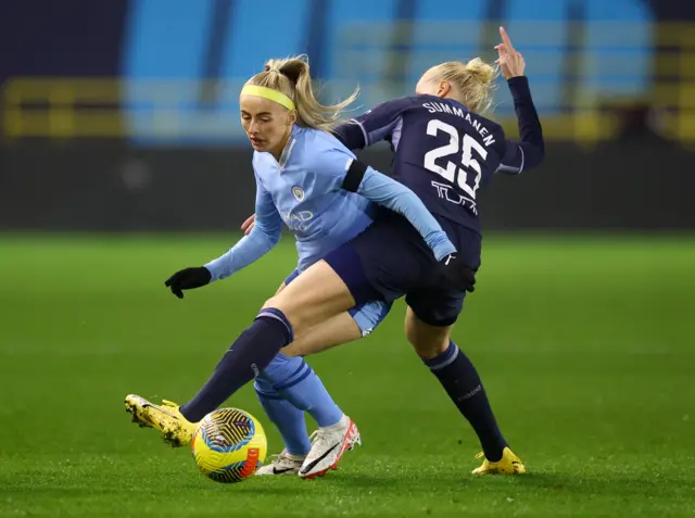 Chloe Kelly in action with Tottenham Hotspur's Eveliina Summanen