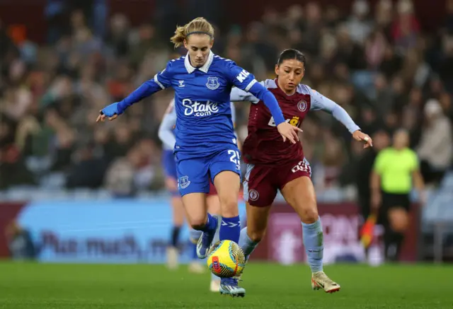 Katja Snoeijs of Everton runs with the ball whilst under pressure from Maz Pacheco