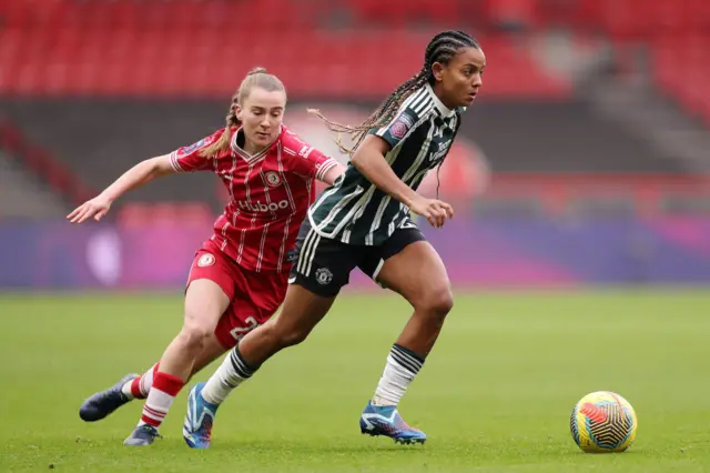 Geyse Da Silva Ferreira runs with the ball for Man Utd.