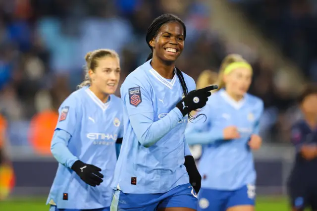 Khadija 'Bunny' Shaw smiles after scoring her third goal.