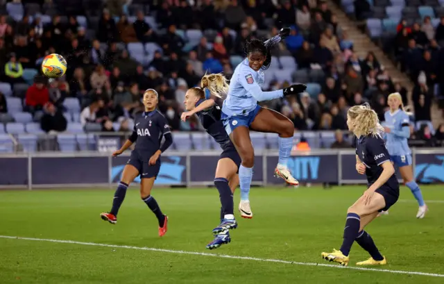 Khadija Shaw's thumping header puts Manchester City ahead.