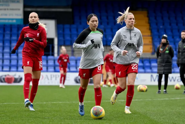 Fuka Nagano warms up with her team mates.