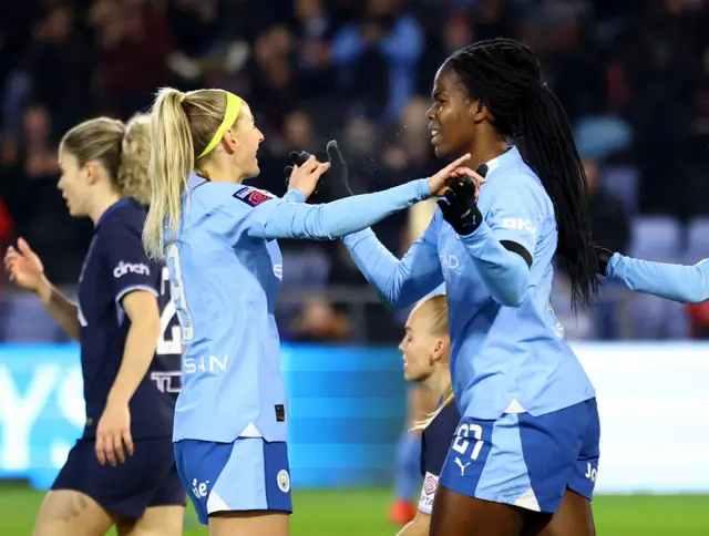 Chloe Kelly and Bunny Shaw celebrate Man City's opener.