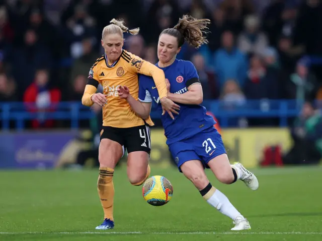 CJ Bott of Leicester City and Niamh Charles of Chelsea battle for the ball