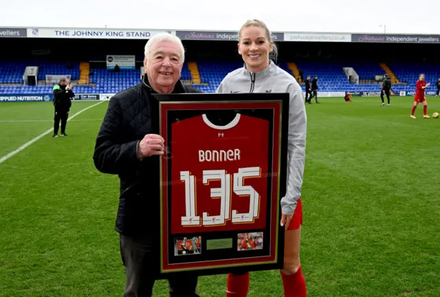 Gemma Bonner receives a commemorative shirt for her 135 appearances.