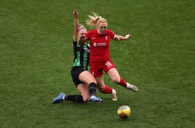 Ceri Holland of Liverpool is tackled by Maisie Symonds.