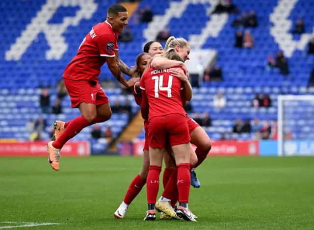 Liverpool celebrate their second goal.