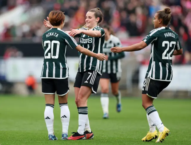 Ella Toone celebrates with Hinata Miyazawa and Nikita Parris.