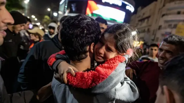 A girl hugs a newly released Palestinian prisoner in Ramallah