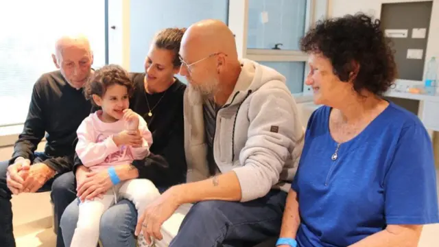 Abigail Edan, who was released after being taken hostage during the October 7 attack on Israel by the Palestinian militant group Hamas, talks with her aunt Liron, uncle Zuli, and grandparents Shlomit and Eitan at Schneider Children's Medical Center of Israel, in Petah Tikva, Israel, in this handout picture released by Schneider Children's Medical Center of Israel on November 27, 2023. Schneider Children's Medical Center of Israel/Handout