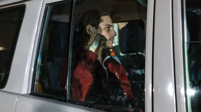 An International Red Cross vehicle carrying Israeli Russian hostage Ron Krivoy released by Hamas drives towards the Rafah border point with Egypt ahead of a transfer to Israel on November 26, 2023.