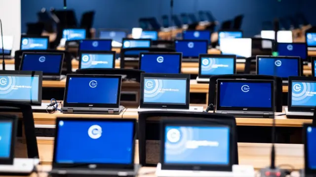 Computers in the room where UK Covid-19 Inquiry is held