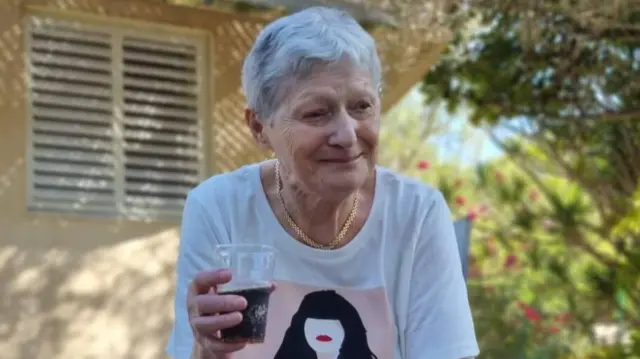 Yafa Adar holding a drink