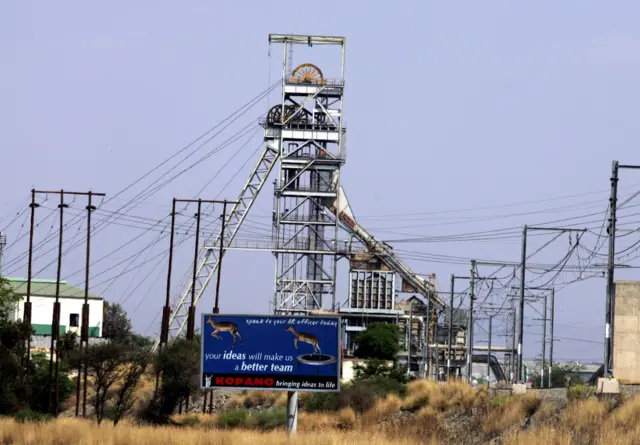 This picture taken 05 October 2004 shows a shift number 1, at a stand still, due to a strike, in Rustenburg, about 100 kilometres northwest of Johannesburg. Some 17,000 miners at Impala Platinum