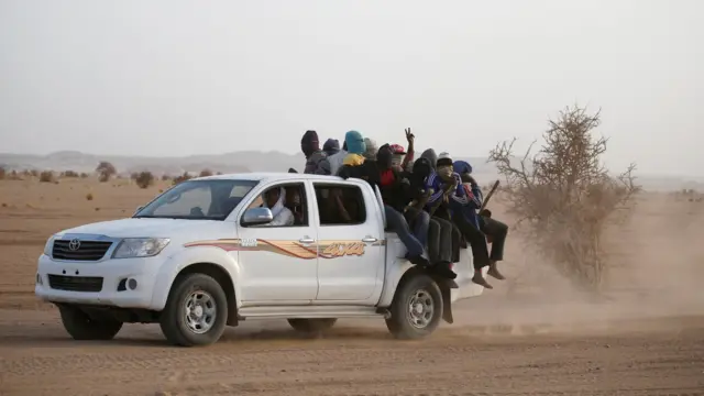 EU migrant crisis: Migrants crossing the Sahara desert into Libya on the back of a truck, Niger, May 9, 2016.