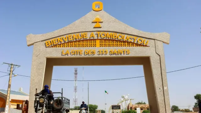 Residents drive past the entrance of Timbuktu, Mali September 29, 2023.