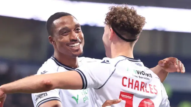 Bolton players celebrating against Exeter